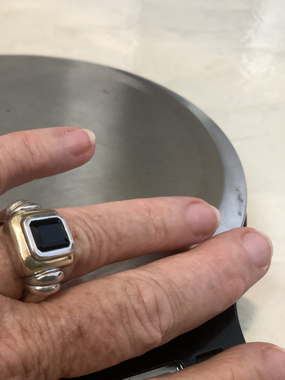 Sterling gold black stone ring.